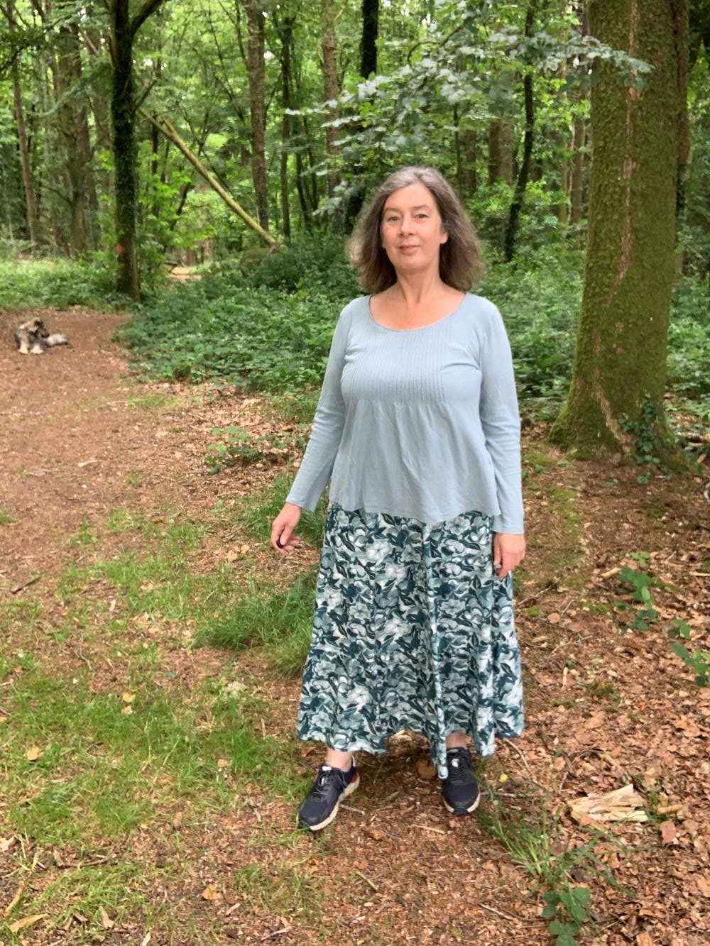 woman and dog in the woods